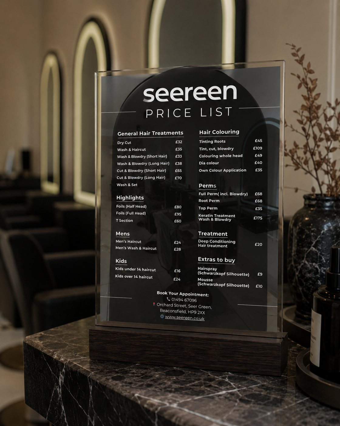 Seereen price list displayed on an acrylic stand in the salon